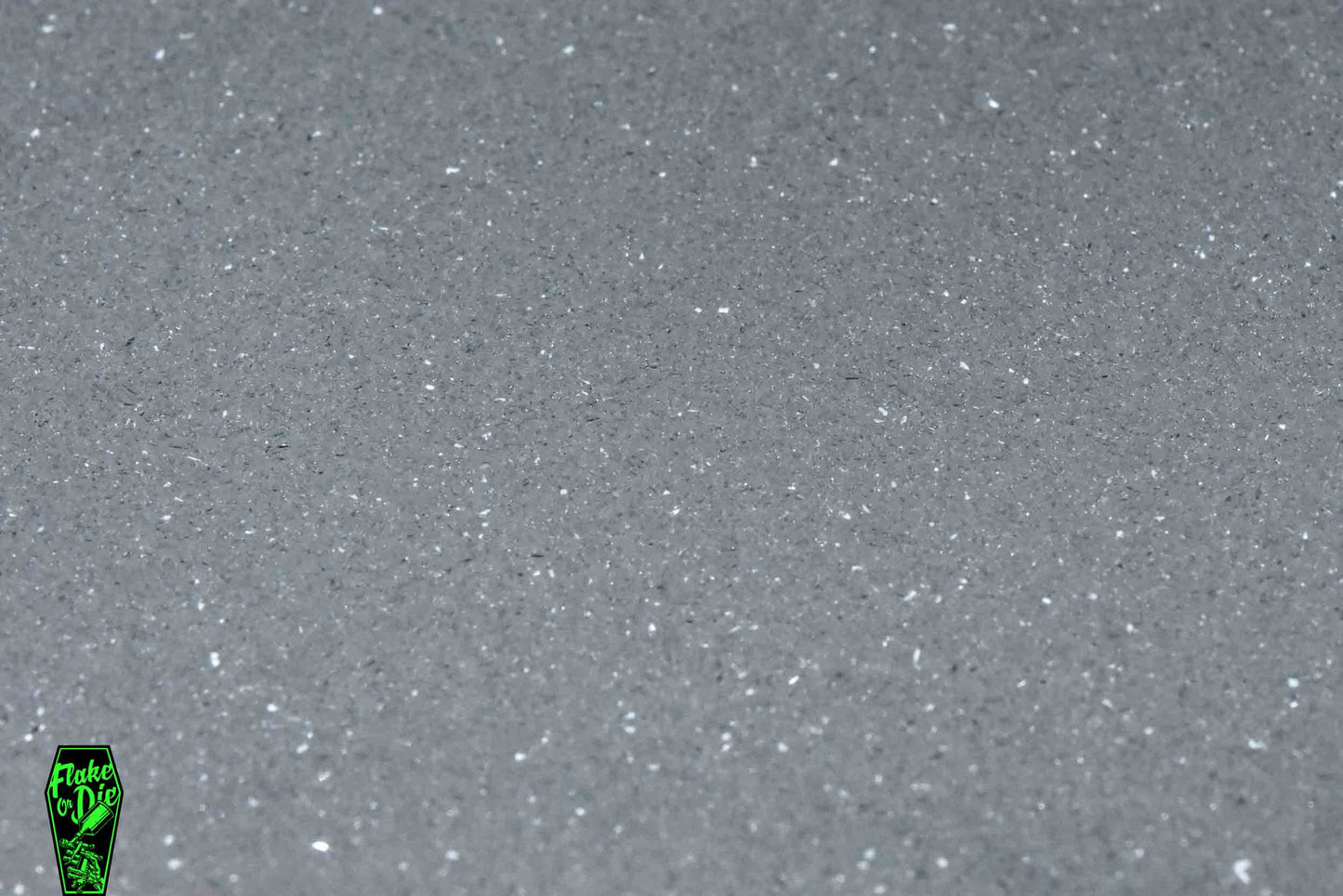 Macro photography product shot of white glass particles in a small pile.