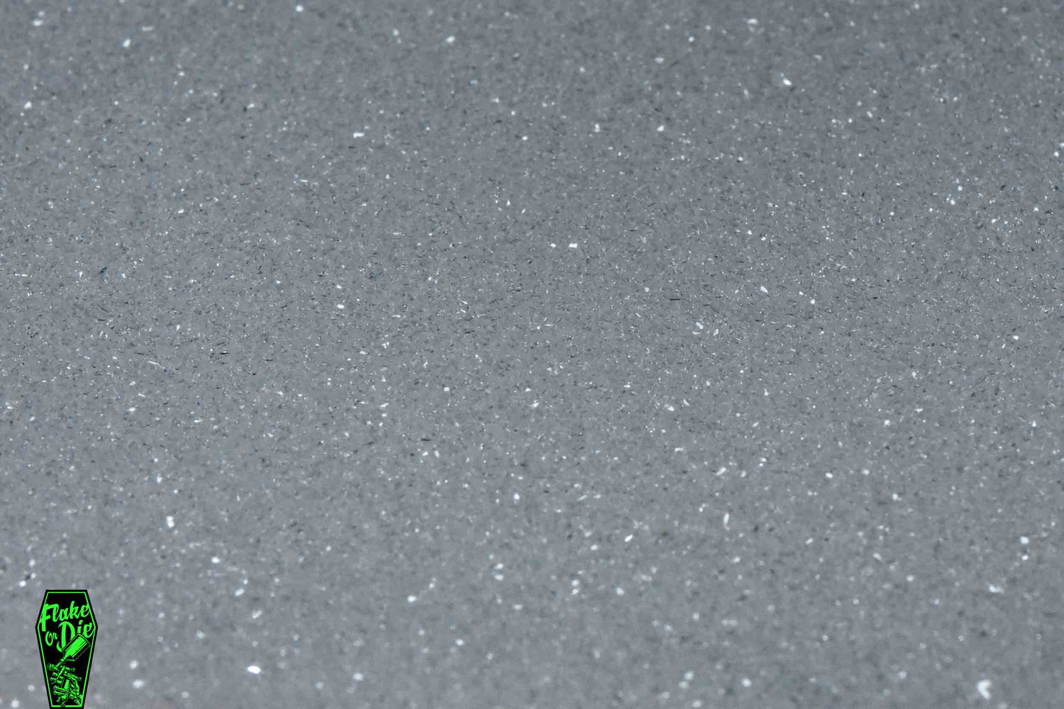 Macro photography product shot of white glass particles in a small pile.