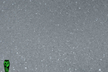 Macro photography product shot of white glass particles in a small pile.