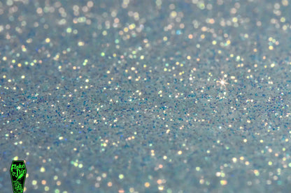 Product photography shot of white colored iridescent metal flake particles smeared flat.