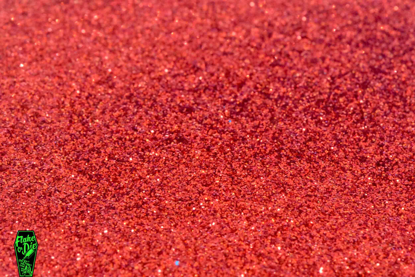 Flake or Die product photography a small pile of red metal flake hex cut particles.