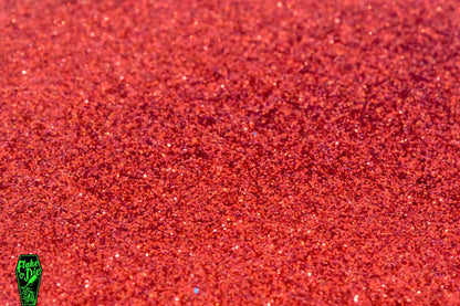 Flake or Die product photography a small pile of red metal flake hex cut particles.