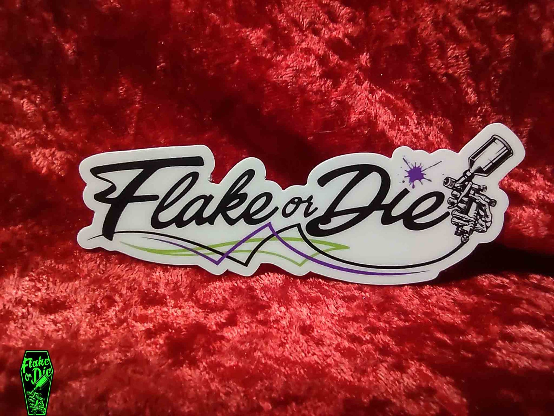 Vinyl sticker, Flake or Die with pinstripe accent and paint splat. on red velvet background