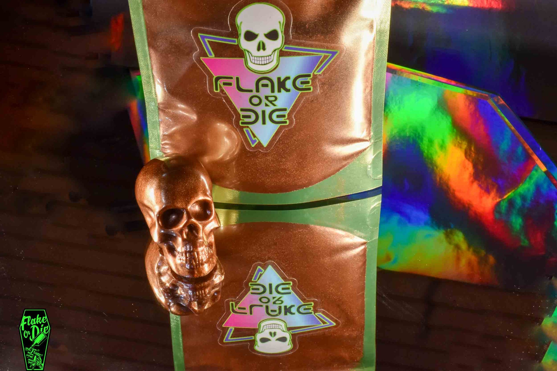 Brown pearl pigment in 1 oz package with Flake or Die sticker and a resin skull made with Skunk Ape brown pearl pigment.